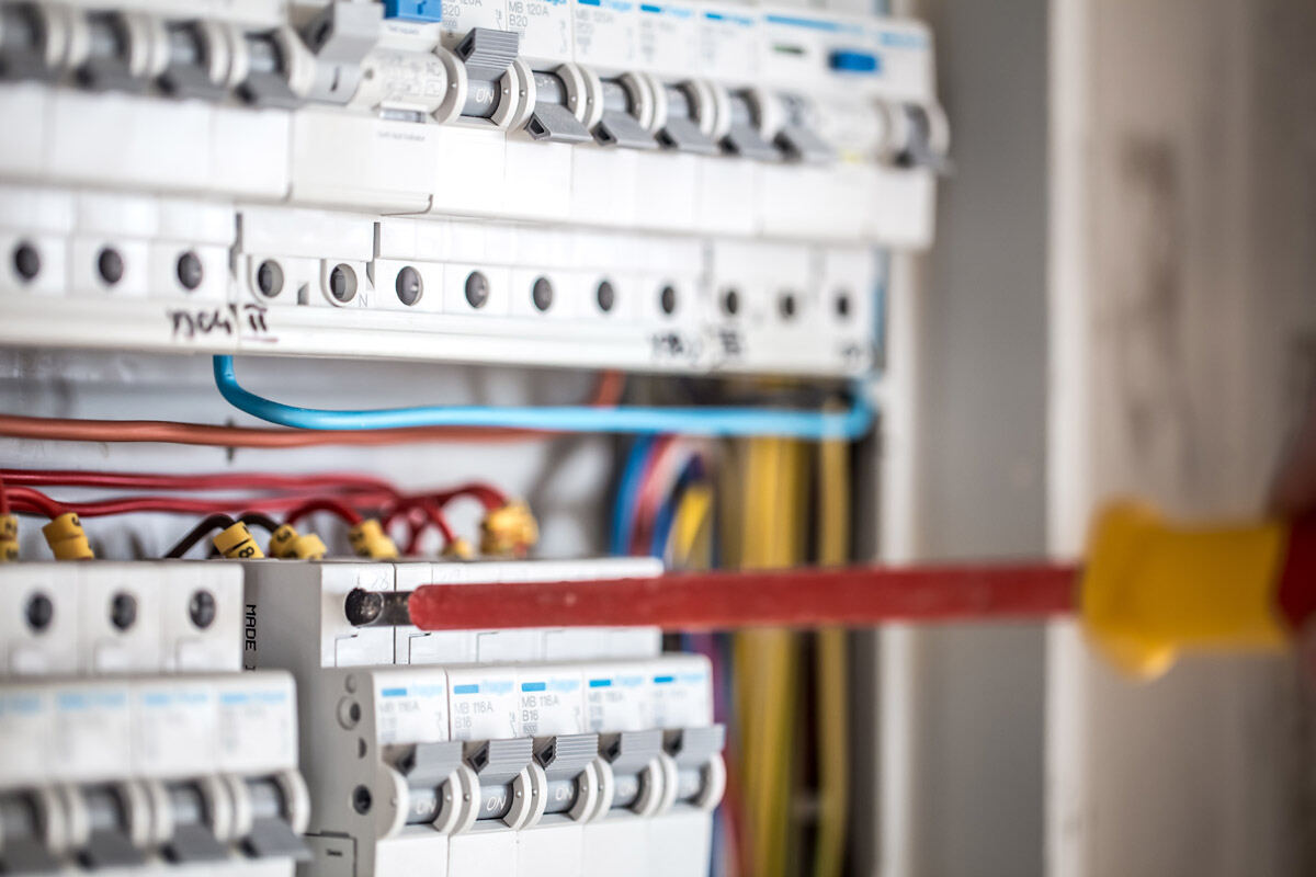 Electrician working on a commercial distribution board